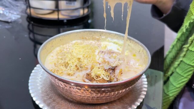 Halim the Persian street food healthy pulled beef stew with lentils mutton chicken garnished coconut sesame cinnamon spices healthy dish spicy curry masala Ramadan dinner Tehran Iran local cuisine