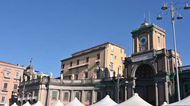 Naples, Italy, December 28, 2024. Footage from Piazza Dante Alighieri in the historic center of Naples, in front of the historic Palazzo Vittorio Emanuele, now a school and convent. Beautiful sunny da