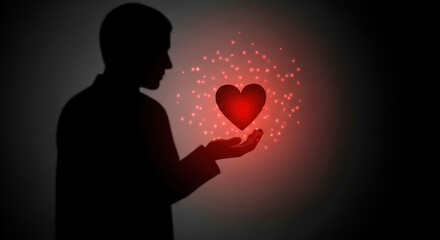 Man Silhouette Holding Glowing Red Heart in Hands