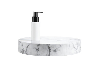 White Lotion Bottle on Marble Stand for Beauty Product Display.