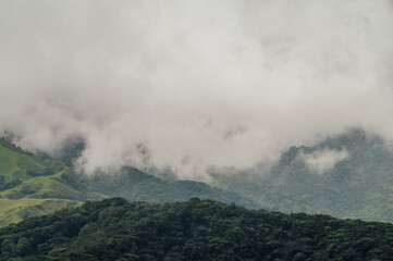 Fototapeta premium Mist Rolling over the Green Hills of Monteverde, Costa Rica