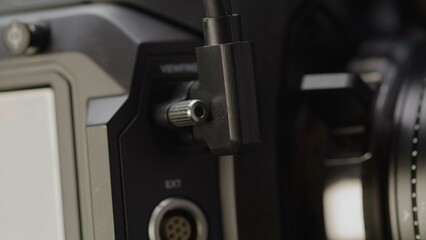 A robust cable securely connects to the professional video.