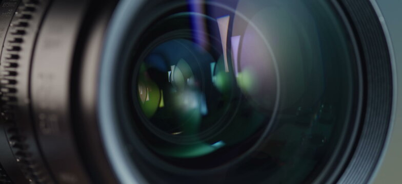 A detailed camera lens displays its intricate optics and colorful.
