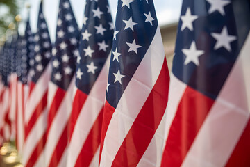 close-up of american flags with stars and stripes in bright daylight
