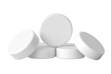 Stack of four white, round tablets