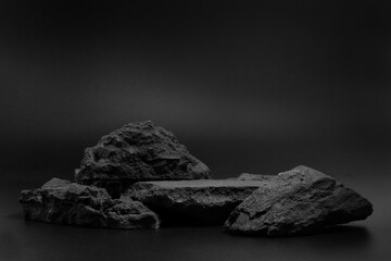 Black stone podium plates product display pedestal. Rock black nature material for placing products fashion cosmetics