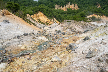 Volcanic landscape with sulfur deposits and hot spring in natural park at Noboribetsu Jigokudani Valley, Noboribetsu, Hokkaido, Japan