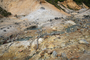 Geothermal hot springs and rocky terrain in volcanic landscape at Noboribetsu Jigokudani Valley, Noboribetsu, Hokkaido, Japan