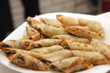 thin pancakes, twisted, with filling, apple, cheese, meat, dessert, snack, appetizing,