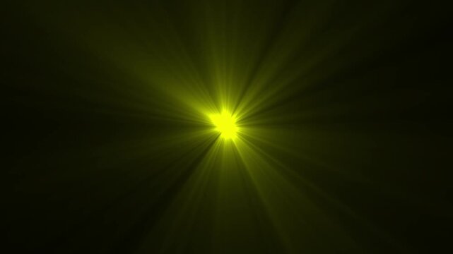 Bright yellow sunburst light flare emanating from center on dark background abstract energy