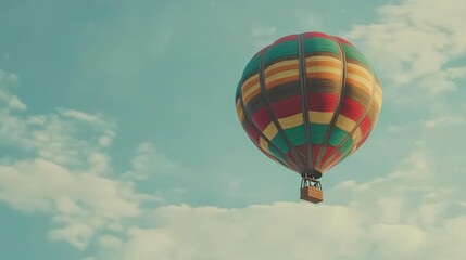 Fototapeta premium A colorful hot air balloon floats against a light blue sky dotted with fluffy white clouds. AI.