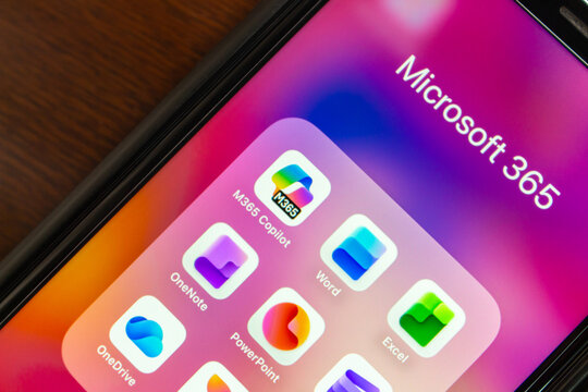 Quito, ECUADOR - Oct 13 2025 : Close-up of Microsoft 365 folder with apps like M365 Copilot, Word, Excel, OneNote, PowerPoint, Clipchamp, OneDrive Microsoft Designer, MS Defender.