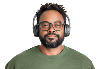 A man with headphones smiling confidently, showcasing modern style and engagement with audio technology.
