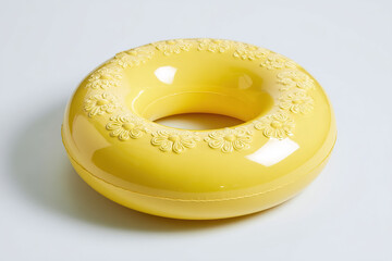 Cheerful yellow swim ring with embossed flowers, ideal for summer fun and safe swimming.  A playful and decorative flotation device.