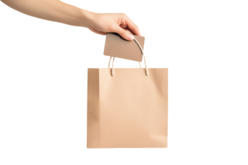 Hand holding a stylish shopping bag with a blank tag, ideal for retail and marketing themes.