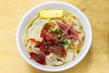 Bowl of Wonton Min Topped with Char Siu, Egg, and Luncheon Meat