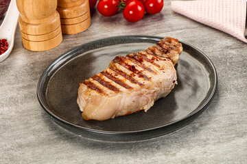 Grilled pork loin steak with bone