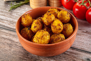 Baked small baby potato with herbs