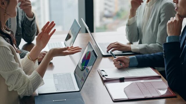 Group of casual business people meeting in an office