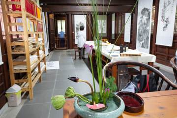 A Zen space, a room with Chinese calligraphy and flower arrangements