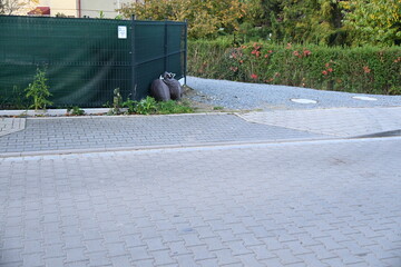 Architectural mistake driveway sidewalk misaligned with gate hitting the fence
