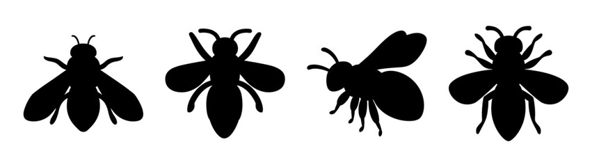 Set of four black bee silhouettes showing different angles and poses insects flying