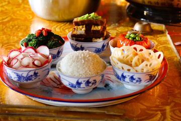 A variety of delicious vegetable foods, symmetrical in Chinese style, for offering to Buddha