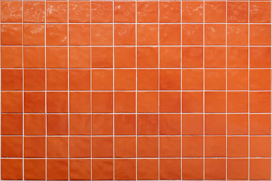 Orange ceramic tile background. Old vintage ceramic tiles in green to decorate the kitchen or bathroom 