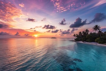Beautiful sunset over the ocean with a palm tree in the background