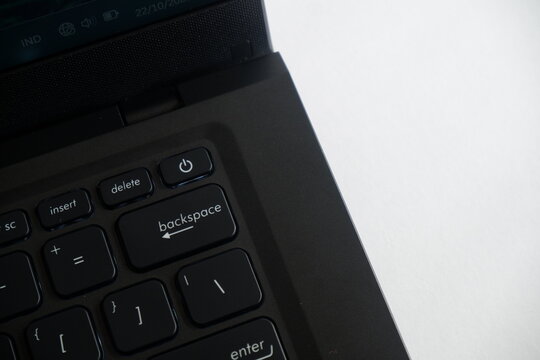 Closeup laptop keyboard focusing on delete and backspace keys