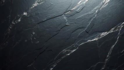 Dark, textured stone surface with subtle veins