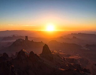 A warm sunset casts a glow over a vast, rocky desert landscape with a few prominent rock formations