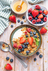 Healthy yogurt granola bowl with fresh berries