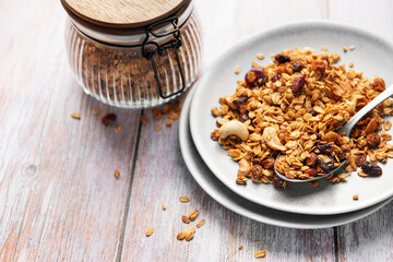 Healthy homemade granola mix on plate with spoon