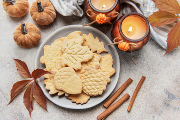 Autumn cookies on plate with cinnamon and fall decor