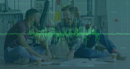 Collaborating men in shirts, jeans working on laptop in office lounge, with papers waveform overlay