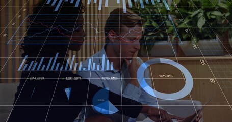 Collaborating professionals in blazers reviewing laptop data with AR graphs in office space