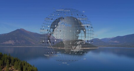 Hovering digital globe wireframe floating above lake in mountain valley, with numeric data labels