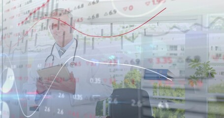 Reviewing tablet doctor wearing white coat and stethoscope in office with binders, chart overlays