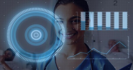 Smiling therapist with stethoscope guiding man curling dumbbell in clinic, showing digital charts
