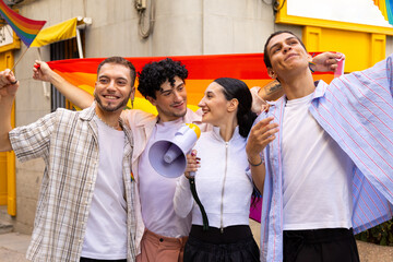 Diverse friends celebrating pride with rainbow flag