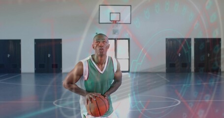 Holding basketball athlete wearing green uniform at free throw line, with digital graphics overlay