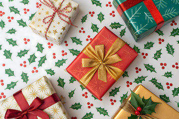 Top view Christmas gifts arranged on festive background