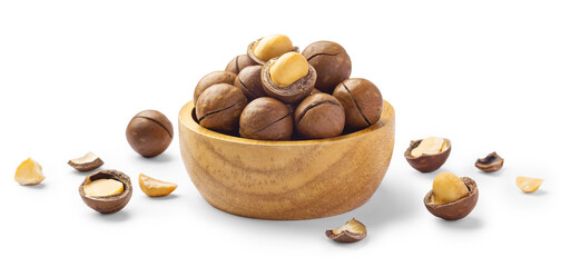 Macadamia nuts in wooden bowl with broken macadamia isolated on white background
