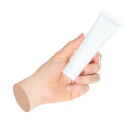 Woman hand holds a white cosmetic cream tube, on transparent background close-up, template for cosmetics ads. Contemporary art