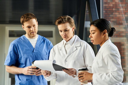 Multicultural team of doctors collaborating in a modern hospital setting - Powered by Adobe