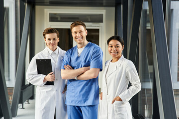 Diverse team of doctors collaborates in a modern hospital setting for patient care