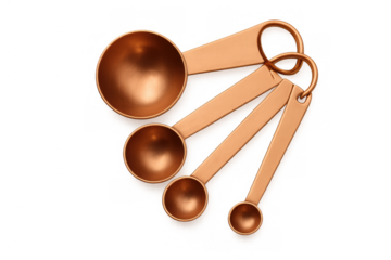 Copper measuring spoons set for cooking and baking ingredients with transparent background