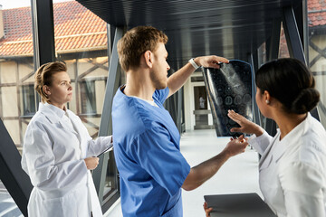 Multicultural doctors collaborate on patient care in a modern hospital setting