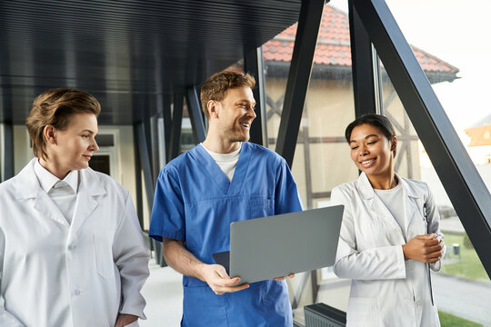 Multicultural medical team collaborates in a modern hospital environment - Powered by Adobe